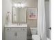 Clean bathroom featuring a vanity with drawers, a mirror and a shower-tub combo at 375 Banbury Xing, Alpharetta, GA 30009