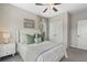 Comfortable bedroom featuring neutral tones, wall art, and a well-lit nightstand at 375 Banbury Xing, Alpharetta, GA 30009