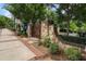 Stone community entrance with landscaped grounds and a secure gate at 375 Banbury Xing, Alpharetta, GA 30009