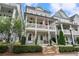 Charming two-story home with a welcoming porch and manicured landscaping, perfect for curb appeal at 375 Banbury Xing, Alpharetta, GA 30009