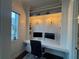 Stylish home office featuring built-in shelves, ample desk space, and natural light at 375 Banbury Xing, Alpharetta, GA 30009