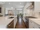 Modern kitchen with stainless steel appliances and a view of the open living area creating an inviting atmosphere at 375 Banbury Xing, Alpharetta, GA 30009