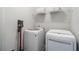 Efficient laundry area with a modern washer and dryer, plus overhead storage to maximize space at 375 Banbury Xing, Alpharetta, GA 30009