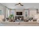 Bright living room with stylish decor, featuring large windows, hardwood floors, and designer furnishings at 375 Banbury Xing, Alpharetta, GA 30009