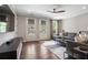 Bright living room with a large sofa, natural light and stylish furniture at 375 Banbury Xing, Alpharetta, GA 30009