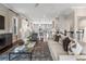 Open-concept living room with hardwood floors, flowing into a modern kitchen, ideal for entertaining and Gathering time at 375 Banbury Xing, Alpharetta, GA 30009