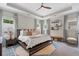 Bright main bedroom with trey ceiling, ceiling fan, large windows, and stylish decor at 375 Banbury Xing, Alpharetta, GA 30009