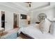 Serene main bedroom with hardwood floors, walk-in closet, modern lighting, and a tray ceiling at 375 Banbury Xing, Alpharetta, GA 30009