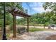 A wooden swing bench in the park is a perfect place to relax and enjoy the lush, natural surroundings at 375 Banbury Xing, Alpharetta, GA 30009