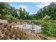 Peaceful pond view with benches, lush landscaping and fountains, perfect for relaxation and contemplation at 375 Banbury Xing, Alpharetta, GA 30009