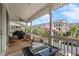Covered front porch featuring outdoor seating, a ceiling fan and street views at 375 Banbury Xing, Alpharetta, GA 30009
