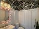 Charming powder room with decorative wallpaper, decorative mirror, and modern fixtures at 375 Banbury Xing, Alpharetta, GA 30009