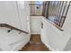 Staircase featuring hardwood steps and modern railings, leading to the lower level of the home at 375 Banbury Xing, Alpharetta, GA 30009