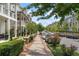 Charming tree-lined street with sidewalks and well-maintained homes creates a welcoming neighborhood atmosphere at 375 Banbury Xing, Alpharetta, GA 30009