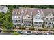 Charming row of well-maintained homes, each featuring inviting front porches and meticulous landscaping at 375 Banbury Xing, Alpharetta, GA 30009