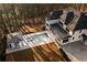 Aerial view showcases a modern home with a luxurious backyard pool and cabana at 5211 Powers Ferry Rd, Sandy Springs, GA 30327