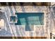 Overhead view of pool featuring in-ground pool, hot tub, concrete paver patio, and manicured lawn at 5211 Powers Ferry Rd, Sandy Springs, GA 30327
