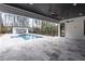 Covered outdoor living space overlooking the pool and lush backyard at 5211 Powers Ferry Rd, Sandy Springs, GA 30327