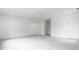 Expansive bedroom features plush carpeting, neutral walls, recessed lighting and multiple doors leading to other areas at 5211 Powers Ferry Rd, Sandy Springs, GA 30327