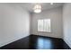 This bedroom offers great light, hardwood floors, and neutral paint at 5211 Powers Ferry Rd, Sandy Springs, GA 30327