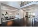 Open-concept dining room featuring a modern chandelier and dark hardwood floors, connected to the living room at 5211 Powers Ferry Rd, Sandy Springs, GA 30327