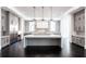 Modern kitchen featuring two center islands, gray cabinetry, stainless steel appliances, and hardwood floors at 5211 Powers Ferry Rd, Sandy Springs, GA 30327