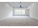 Spacious living room features a large window bringing in plenty of natural light and plush carpeting at 5211 Powers Ferry Rd, Sandy Springs, GA 30327