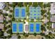 Aerial view showcasing community tennis courts surrounded by lush greenery and homes at 7285 Cordery Rd, Cumming, GA 30040