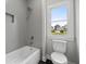 Bathroom showcasing a tiled shower/tub combo and a modern toilet at 7285 Cordery Rd, Cumming, GA 30040