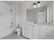 Elegant bathroom with white cabinets, stylish fixtures, and decorative tile flooring at 7285 Cordery Rd, Cumming, GA 30040