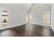 Primary bedroom with vaulted ceilings and exterior access at 7285 Cordery Rd, Cumming, GA 30040