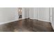 Bedroom with multiple windows, hardwood floors, and a bathroom with dual vanities at 7285 Cordery Rd, Cumming, GA 30040