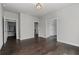 Spacious hallway featuring hardwood floors and multiple doorways leading to other rooms at 7285 Cordery Rd, Cumming, GA 30040