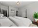 Comfortable main bedroom with a plush bed, neutral tones, and ample natural light at 7285 Cordery Rd, Cumming, GA 30040