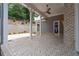 Covered outdoor patio featuring brick flooring, pillars, and a backyard view at 7285 Cordery Rd, Cumming, GA 30040