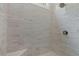 Modern shower featuring light grey tile and updated fixtures at 7285 Cordery Rd, Cumming, GA 30040