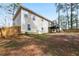 View of the backyard, wooden fence, deck, and partial house view at 1284 Old Villa Rica Rd, Dallas, GA 30157