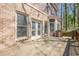 Brick facade with patio and steps, offering a shaded outdoor area at 2647 Brickell Sq, Atlanta, GA 30341