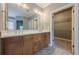 Bathroom with double vanity, granite countertop, and walk-in closet at 2647 Brickell Sq, Atlanta, GA 30341