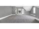 Large carpeted bedroom with multiple entryways and many windows providing natural light at 2647 Brickell Sq, Atlanta, GA 30341