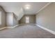 Spacious carpeted bedroom with neutral walls, angular ceilings, and a bright window at 2647 Brickell Sq, Atlanta, GA 30341