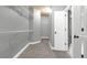 Walk-in closet with wire shelving and carpeting with an ensuite bathroom in the background at 2647 Brickell Sq, Atlanta, GA 30341