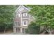Charming two-story home with brown shingle and brick exterior and attached two-car garage at 2647 Brickell Sq, Atlanta, GA 30341