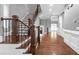 Spacious foyer with hardwood floors, dark wood staircase, and a view into the living areas at 2647 Brickell Sq, Atlanta, GA 30341