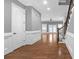 Open foyer featuring hardwood floors, staircase, and a seamless transition into the living space at 2647 Brickell Sq, Atlanta, GA 30341
