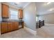 Hallway with carpet and a sink with dark wood cabinets near a decorative railing at 2647 Brickell Sq, Atlanta, GA 30341