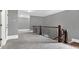 Hallway with decorative wrought iron railing and doors leading to other rooms at 2647 Brickell Sq, Atlanta, GA 30341