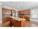 Updated kitchen with stainless steel appliances, center island with seating, and stylish pendant lighting at 2647 Brickell Sq, Atlanta, GA 30341