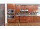 Kitchen featuring stainless steel appliances, granite countertops, and wooden cabinetry for a modern cooking experience at 2647 Brickell Sq, Atlanta, GA 30341