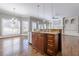 Open concept view of kitchen island, seamlessly flowing into the adjacent room with a fireplace at 2647 Brickell Sq, Atlanta, GA 30341